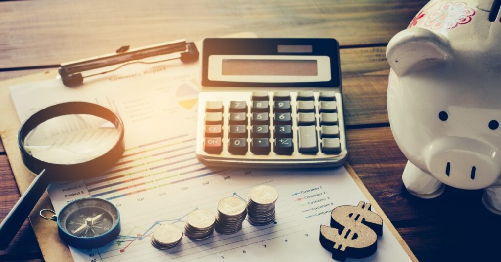 piggy bank with calculator and financial things